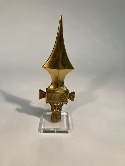 Flag point. 
In chased gilt bronze, with...