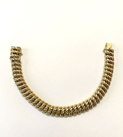 Bracelet articulé en or jaune 750 millièmes,...