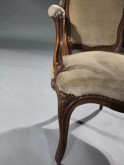 Four molded and carved beech armchairs, the...