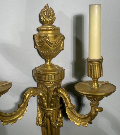 Pair of two-light ormolu sconces decorated...