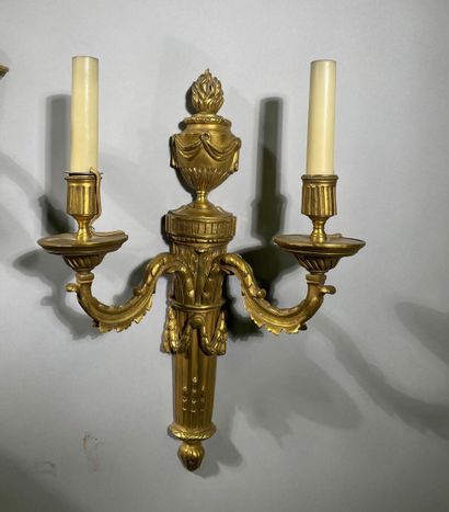 Pair of two-light ormolu sconces decorated...