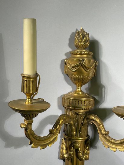 Pair of two-light ormolu sconces decorated...