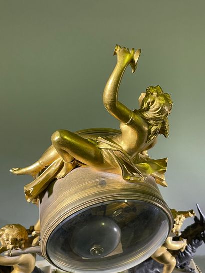 Bacchante clock in patinated bronze, gilt...