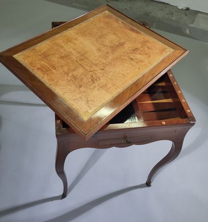Solid mahogany game table, the scalloped...