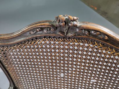 Pair of caned armchairs in molded and carved...
