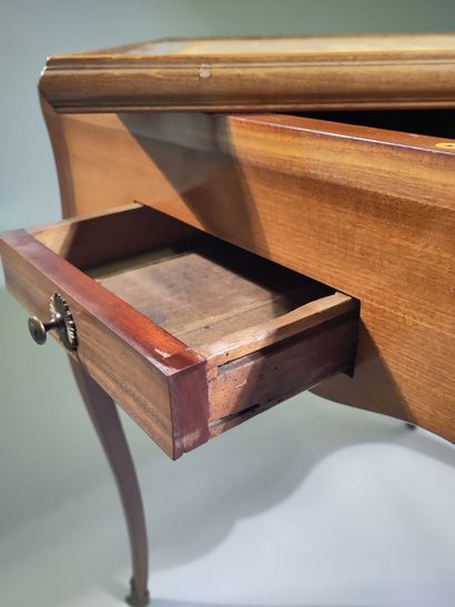Solid mahogany game table, the scalloped...