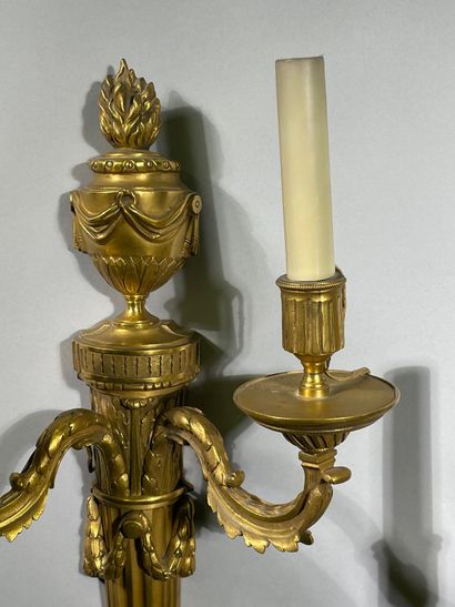 Pair of two-light ormolu sconces decorated...