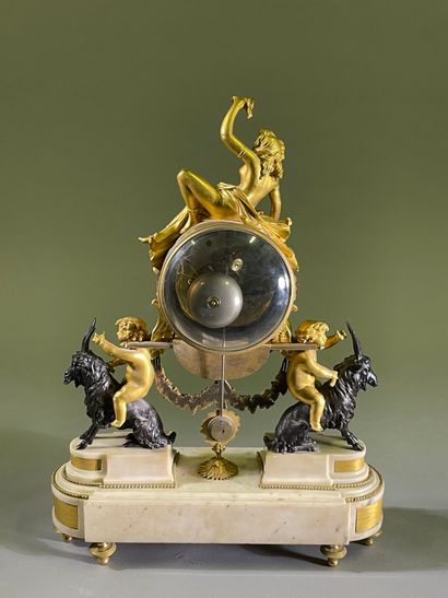 Bacchante clock in patinated bronze, gilt...