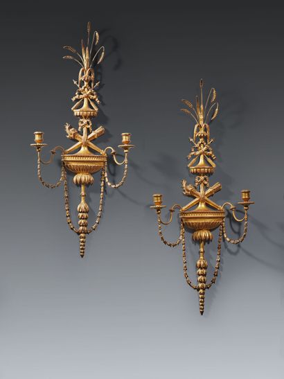 Paire d'appliques en bois doré à deux bras...