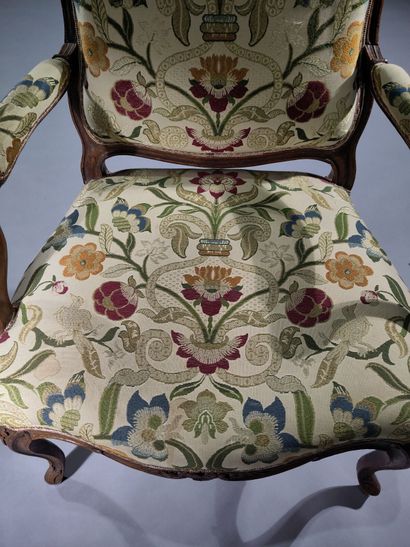 Flat-backed armchair in molded and carved...