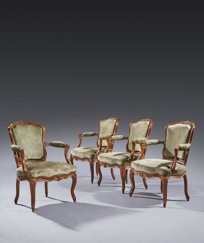 Four molded and carved beech armchairs, the...