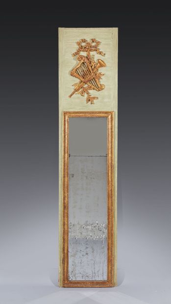 Overmantel mirror between two windows, the...