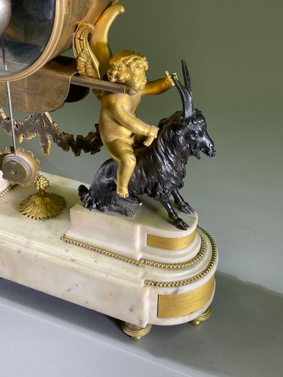 Bacchante clock in patinated bronze, gilt...
