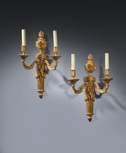Pair of two-light ormolu sconces decorated...