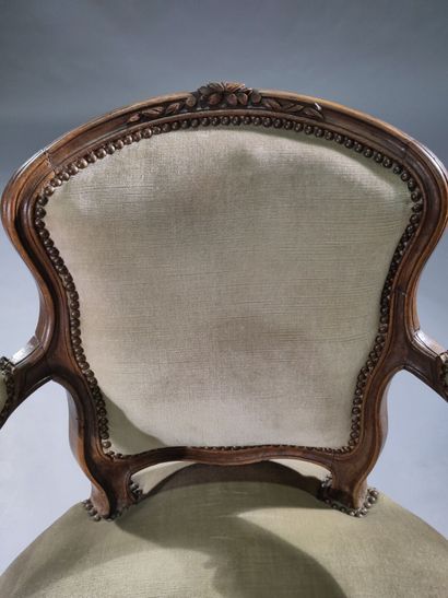 Four molded and carved beech armchairs, the...