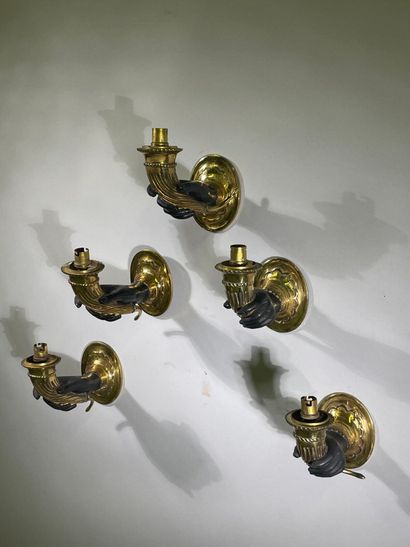 Suite of five one-arm sconces in bronze and...