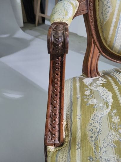 Suite of four molded and carved beech armchairs...