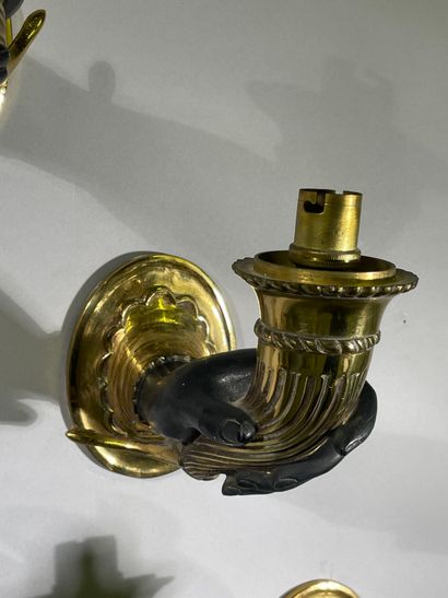 Suite of five one-arm sconces in bronze and...