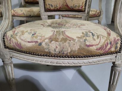 Six armchairs and a sofa in molded, carved...