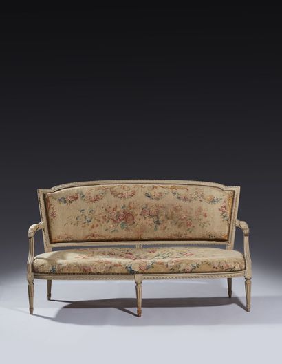 Six armchairs and a sofa in molded, carved...