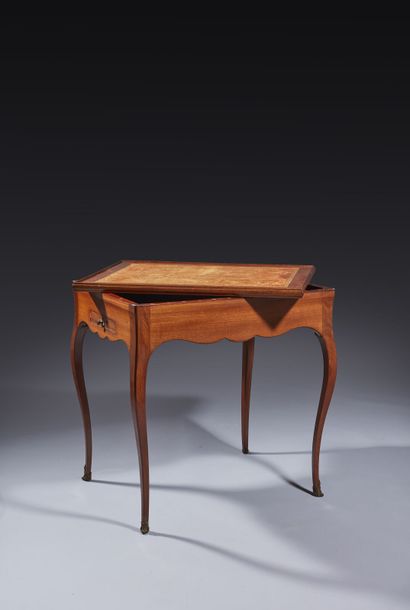 Solid mahogany game table, the scalloped...