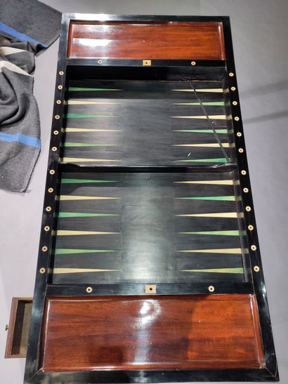 Mahogany and ebony game table, opening with...