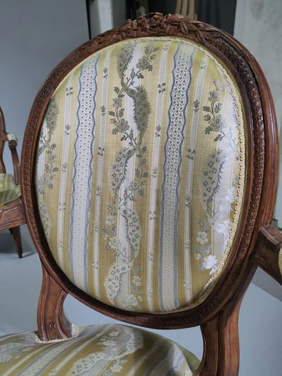 Suite of four molded and carved beech armchairs...
