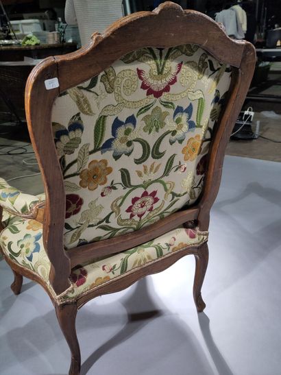 Flat-backed armchair in molded and carved...