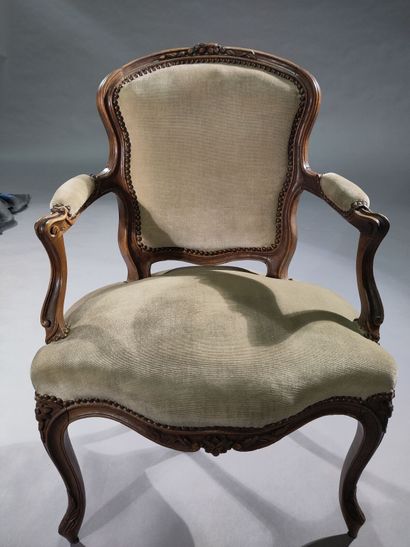 Four molded and carved beech armchairs, the...