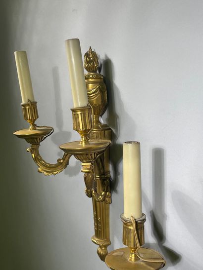 Pair of two-light ormolu sconces decorated...