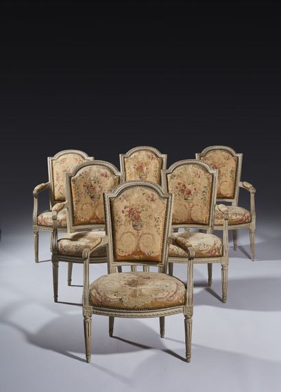 Six armchairs and a sofa in molded, carved...
