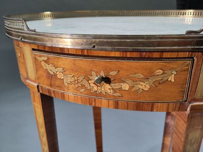 Small oval writing table, in marquetry of...