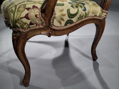 Flat-backed armchair in molded and carved...