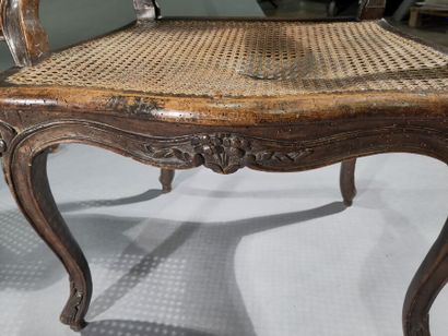 Pair of caned armchairs in molded and carved...
