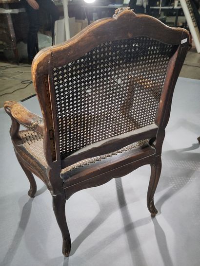 Pair of caned armchairs in molded and carved...