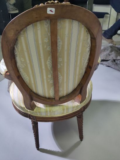 Suite of four molded and carved beech armchairs...