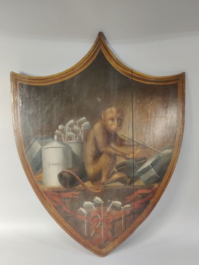 Paire de panneaux peints en forme d'écusson...