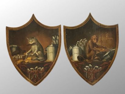 Paire de panneaux peints en forme d'écusson...