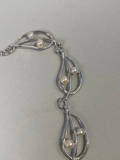 Set of two necklaces, one with leaves, the...