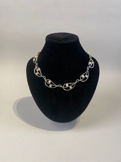 Set of two necklaces, one with leaves, the...