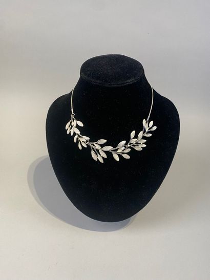 Set of two necklaces, one with leaves, the...