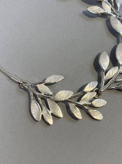 Set of two necklaces, one with leaves, the...