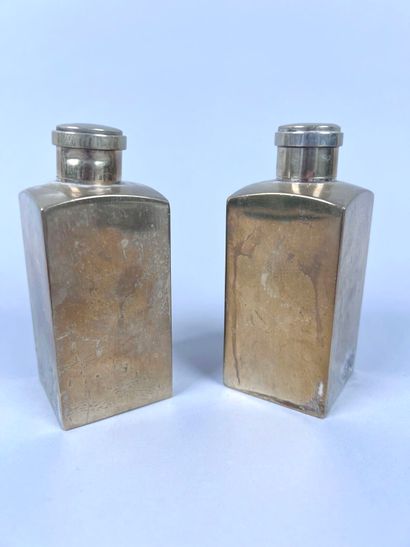 HERMÈS Paris
Two covered perfume bottles...
