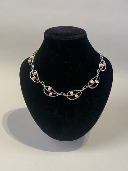 Set of two necklaces, one with leaves, the...