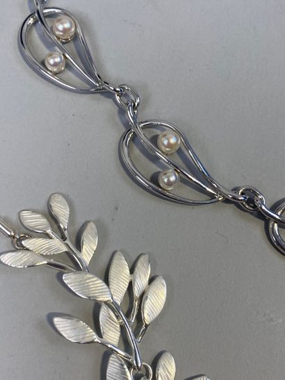 Set of two necklaces, one with leaves, the...
