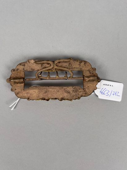 Gilt metal belt buckle decorated with stylized...