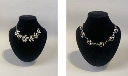 Set of two necklaces, one with leaves, the...