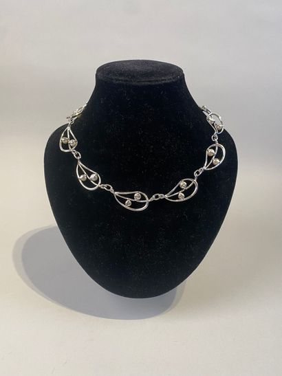 Set of two necklaces, one with leaves, the...