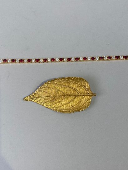 Set includes a gilded metal leaf brooch and...