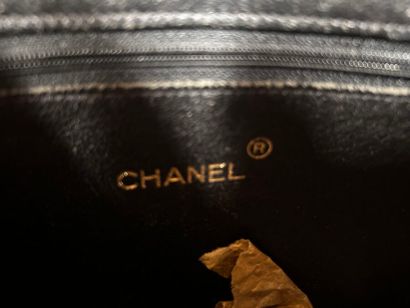 CHANEL 
Black ostrich leather 